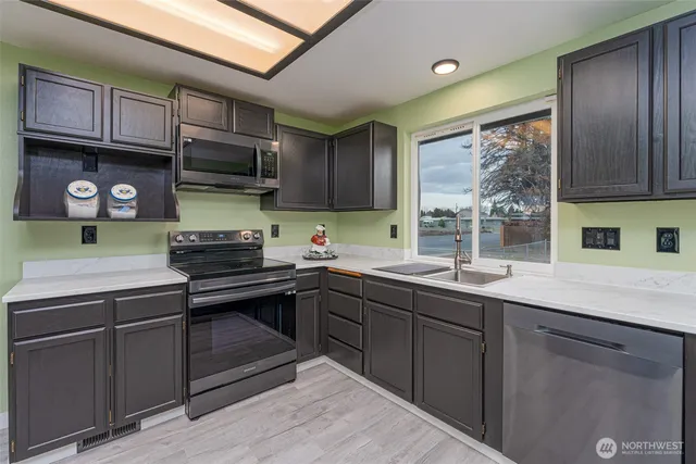 a kitchen with a table and chairs in it