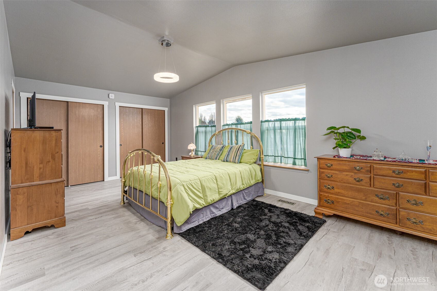 227 O Street Southwest Quincy, WA 98848 - Photo 13 of 30 a bedroom with a bed dresser and a large window