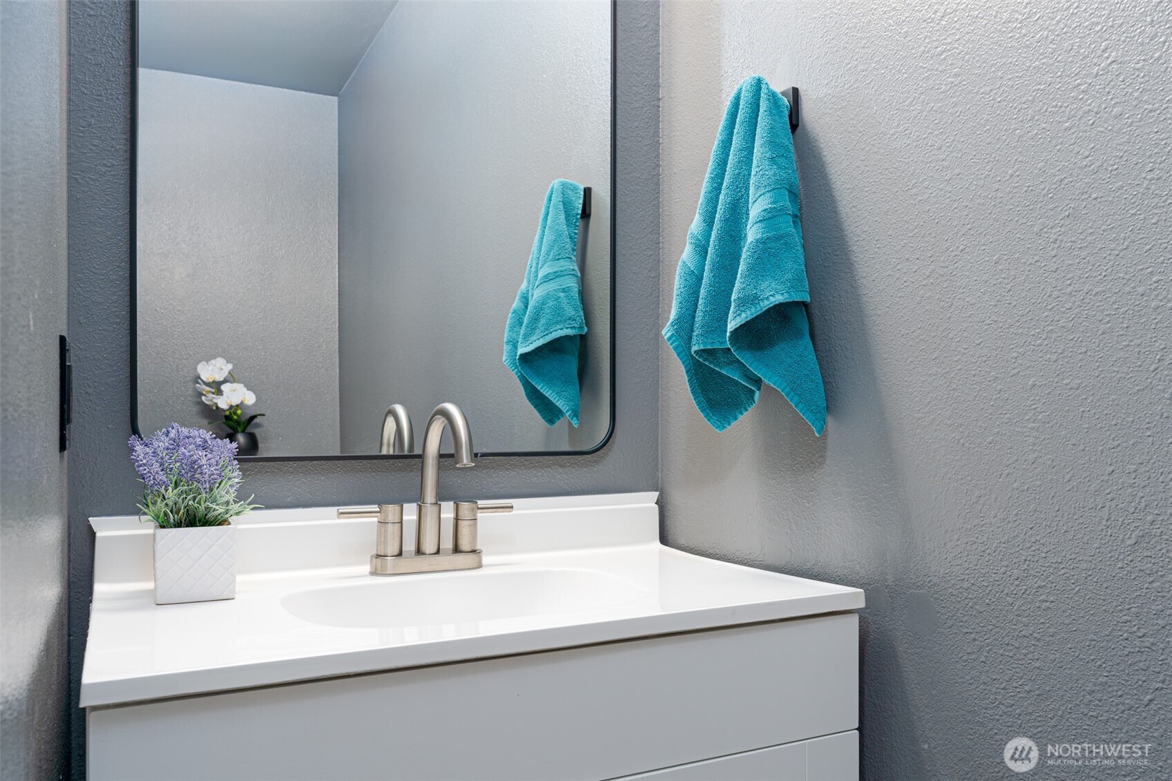 227 O Street Southwest Quincy, WA 98848 - Photo 22 of 30 a bathroom with a sink and a mirror