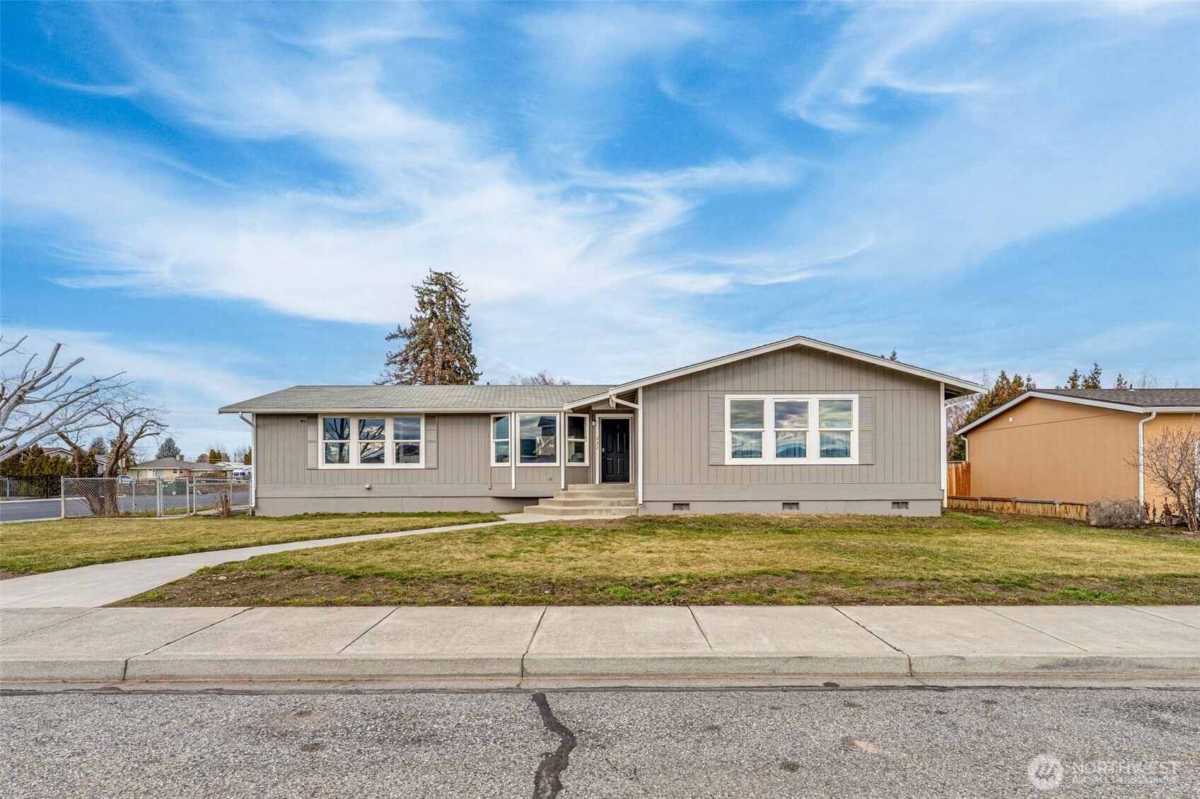 227 O Street Southwest Quincy, WA 98848 - Photo 24 of 30 a view of a house with a big yard and large trees
