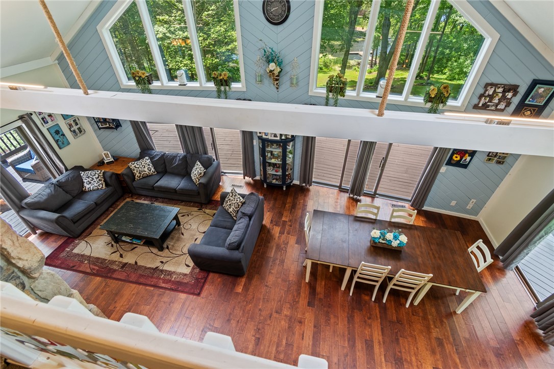 7733 East Port Bay Road Wolcott, NY 14590 - Photo 32 of 49 The loft view of the GREAT ROOM- let's check out the upstairs!