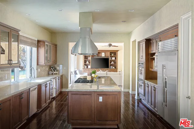 a kitchen with sink cabinets and window