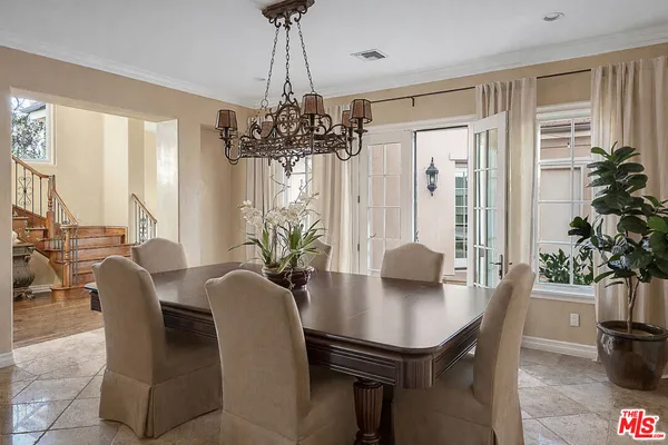 a view of a dining room with furniture and window