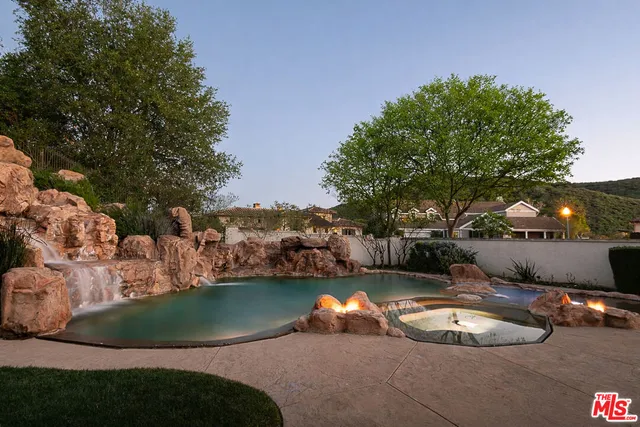 a view of a lake in middle of forest
