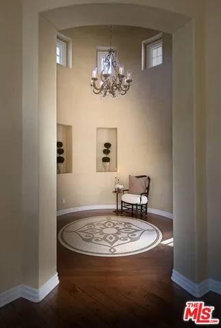 a view of a dining room with a table and chairs