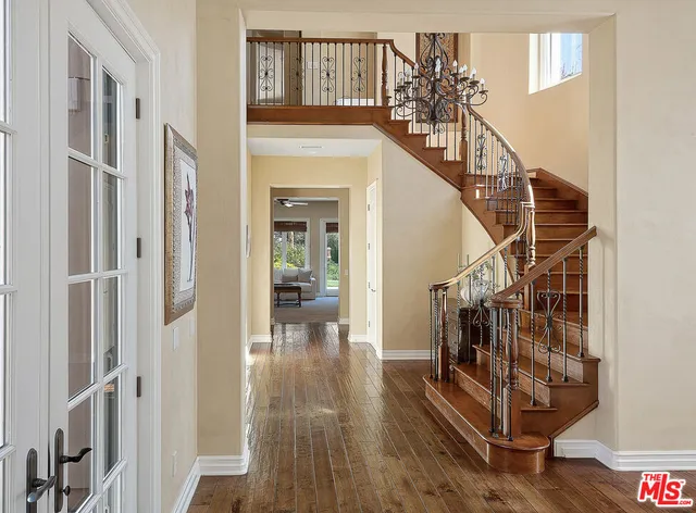 a view of entryway with wooden floor