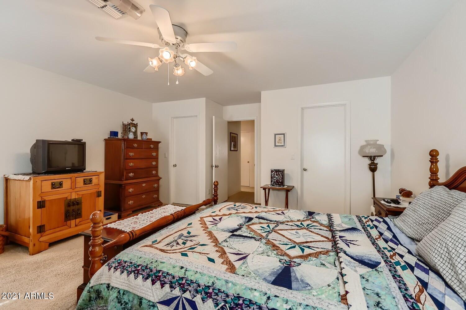 4307 East St John Road Phoenix, AZ 85032 - Photo 18 of 27 a bedroom with a bed and furniture