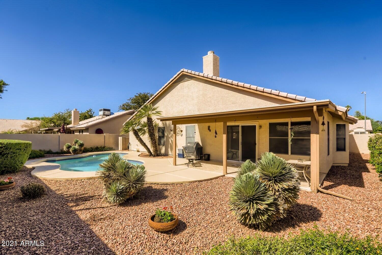 4307 East St John Road Phoenix, AZ 85032 - Photo 26 of 27 a front view of a house with garden