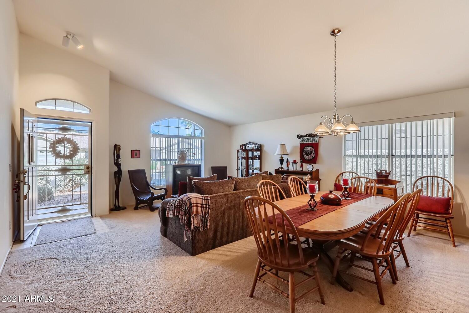 4307 East St John Road Phoenix, AZ 85032 - Photo 3 of 27 a view of a dining room with furniture window and outside view