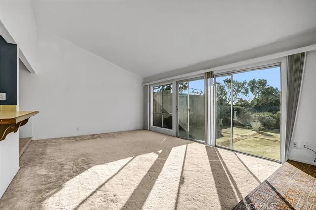 a view of a living room and a large window
