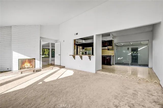 a view of a livingroom with furniture and a ceiling fan