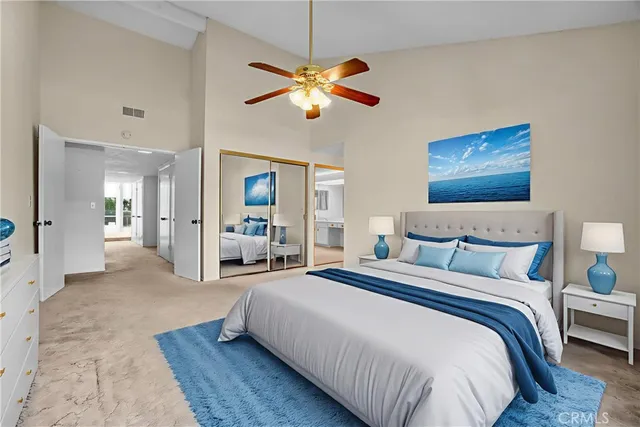 a spacious bathroom with a double vanity sink and mirror