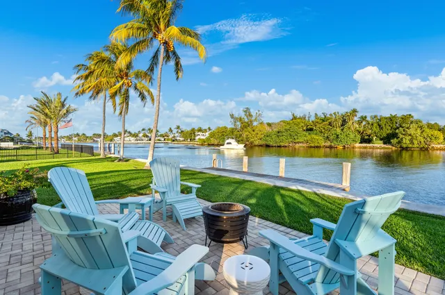 a view of a swimming pool and lounge chairs