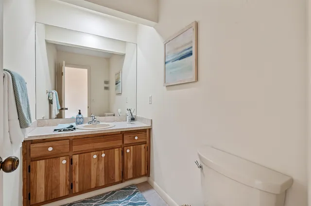 a bathroom with a double vanity sink and mirror