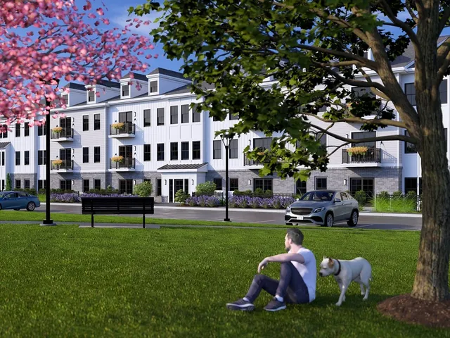 a front view of building with yard and green space