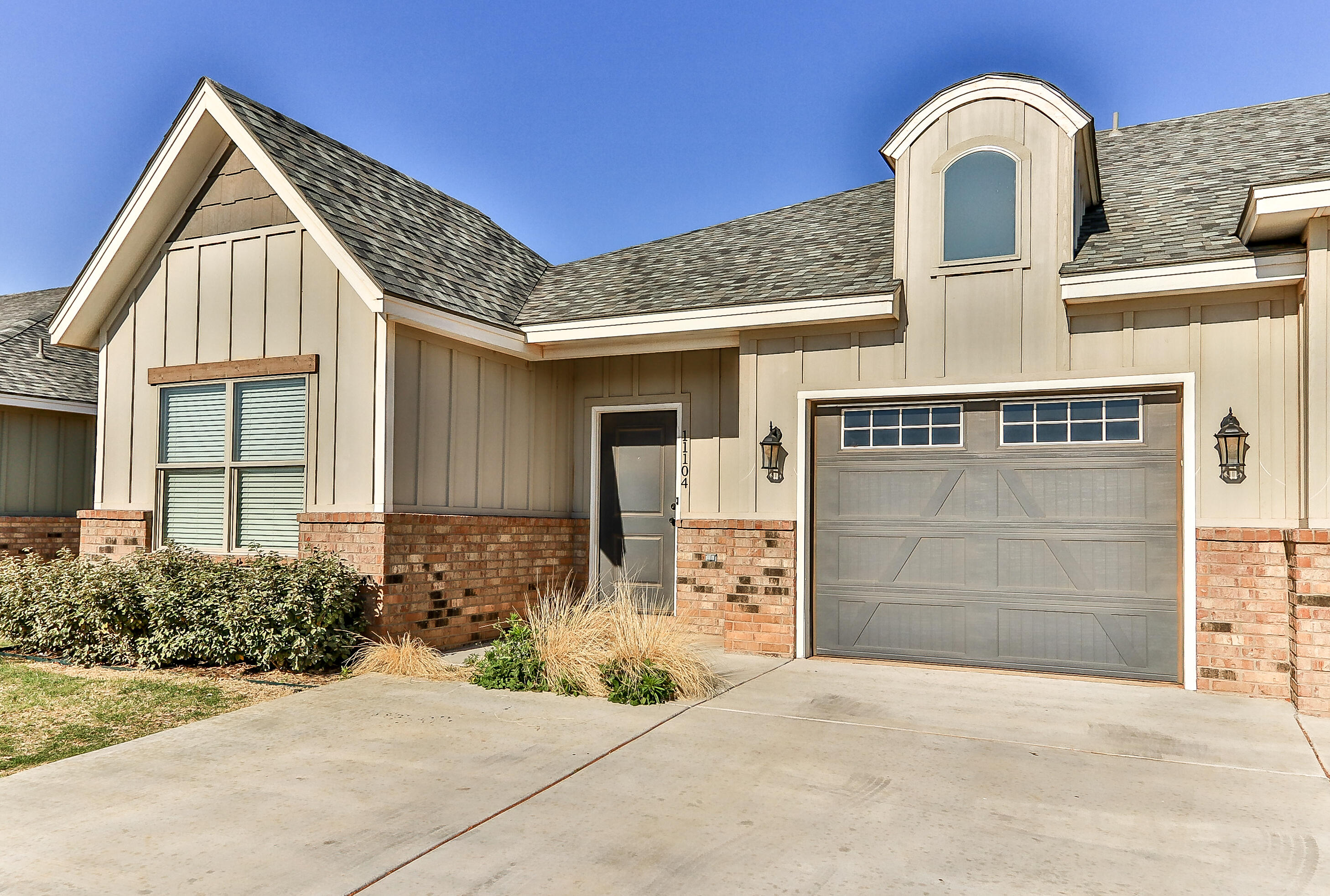 2518 B 111th Street Lubbock, TX 79423 - Photo 1 of 23 a front view of a house with garden