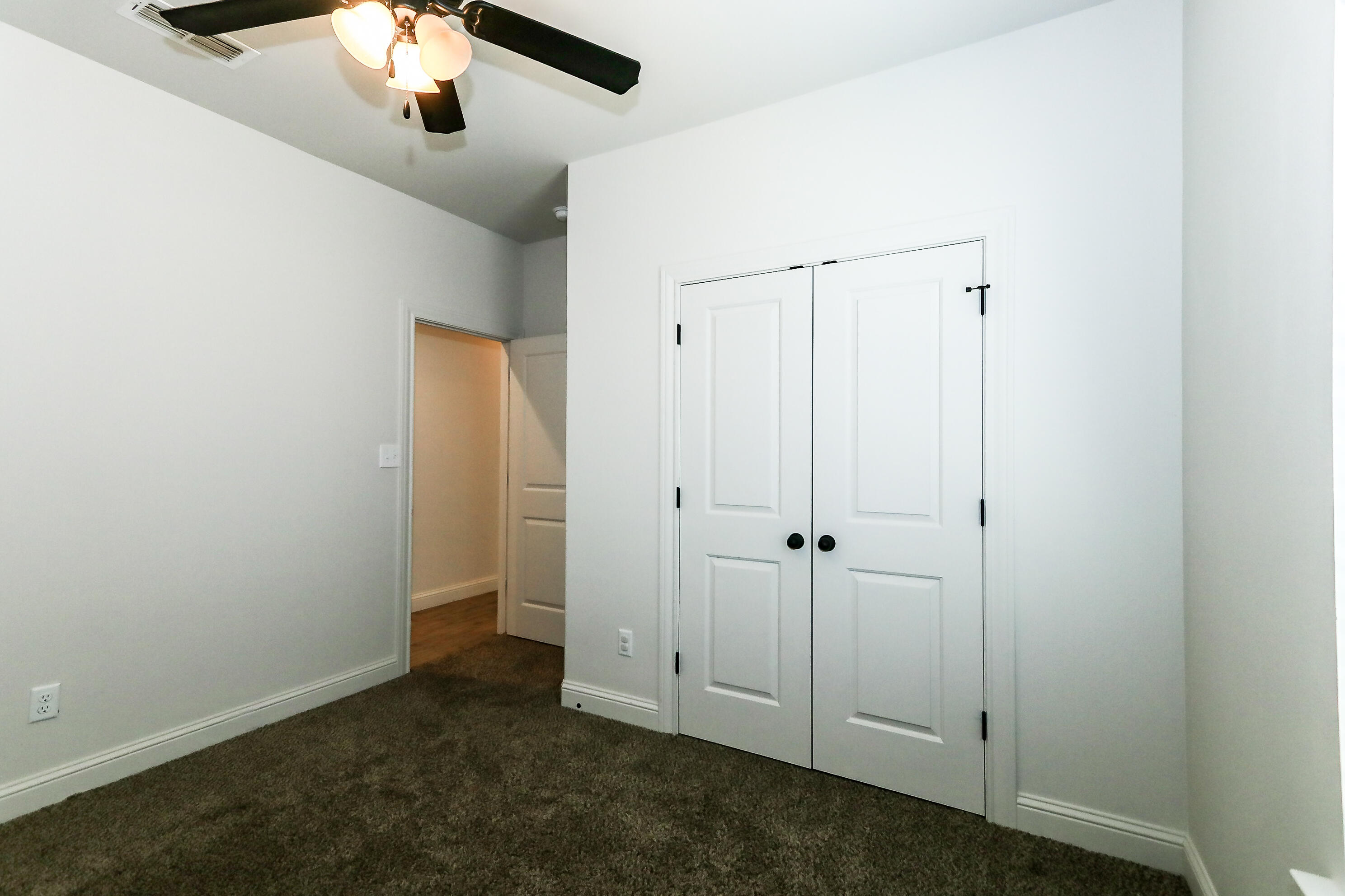 2518 B 111th Street Lubbock, TX 79423 - Photo 17 of 23 an empty room with chandelier fan
