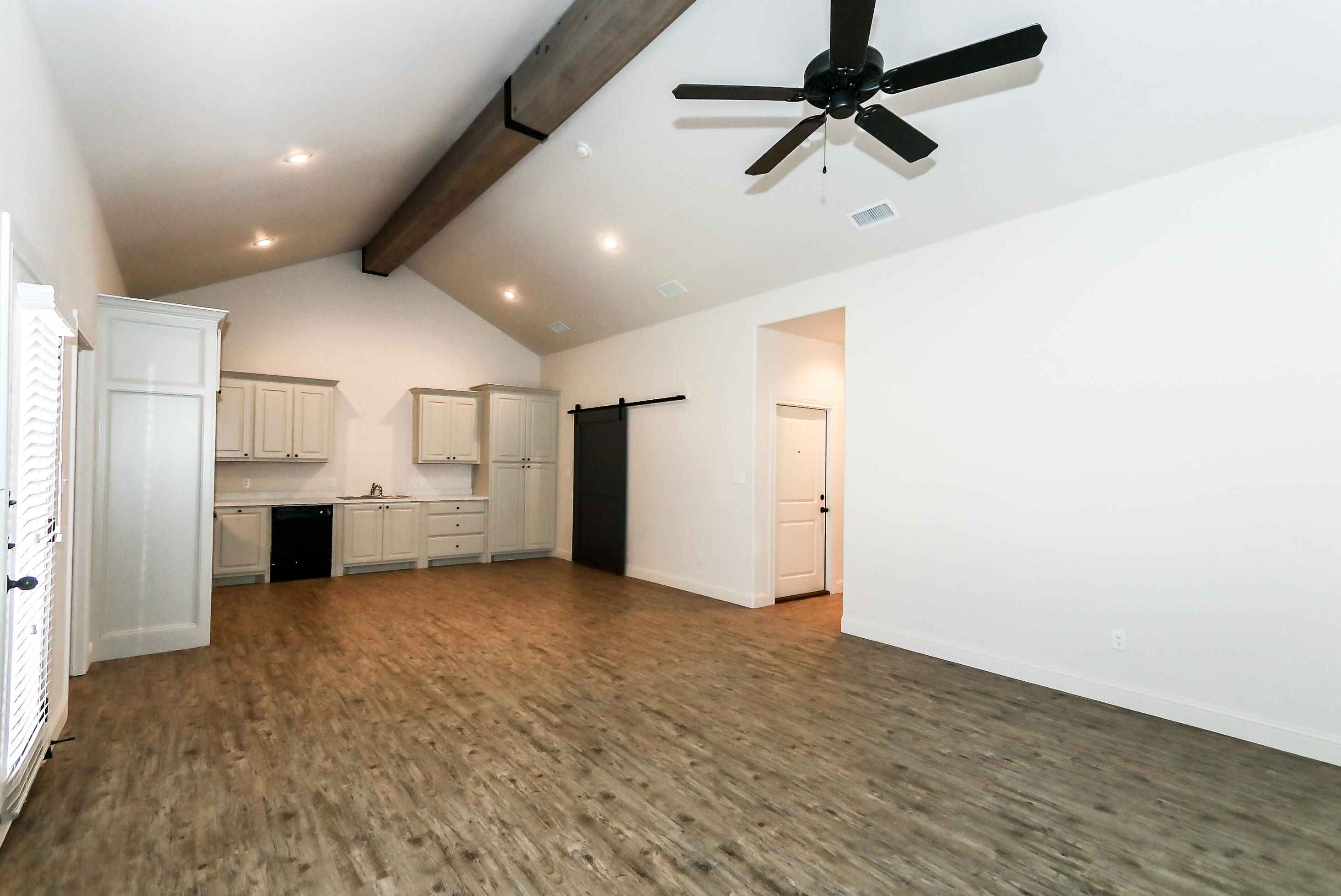 2518 B 111th Street Lubbock, TX 79423 - Photo 7 of 23 a view of a big room with closet and windows