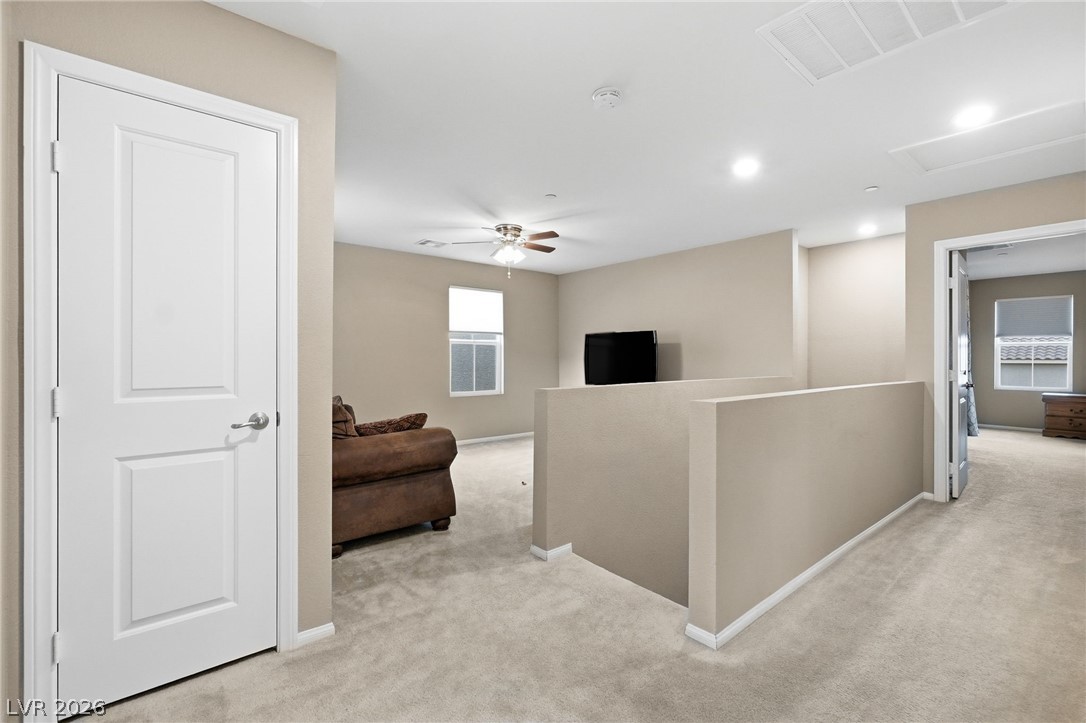 150 Fulgora Street Henderson, NV 89074 - Photo 40 of 92 Hallway featuring an upstairs loft and light carpet