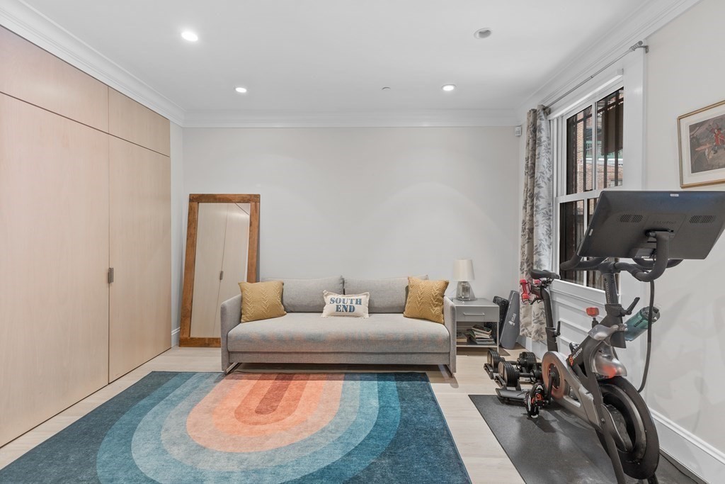 192 West Springfield Street, Unit 1 Boston, MA 02118 - Photo 18 of 26 a living room with furniture and a gym equipment