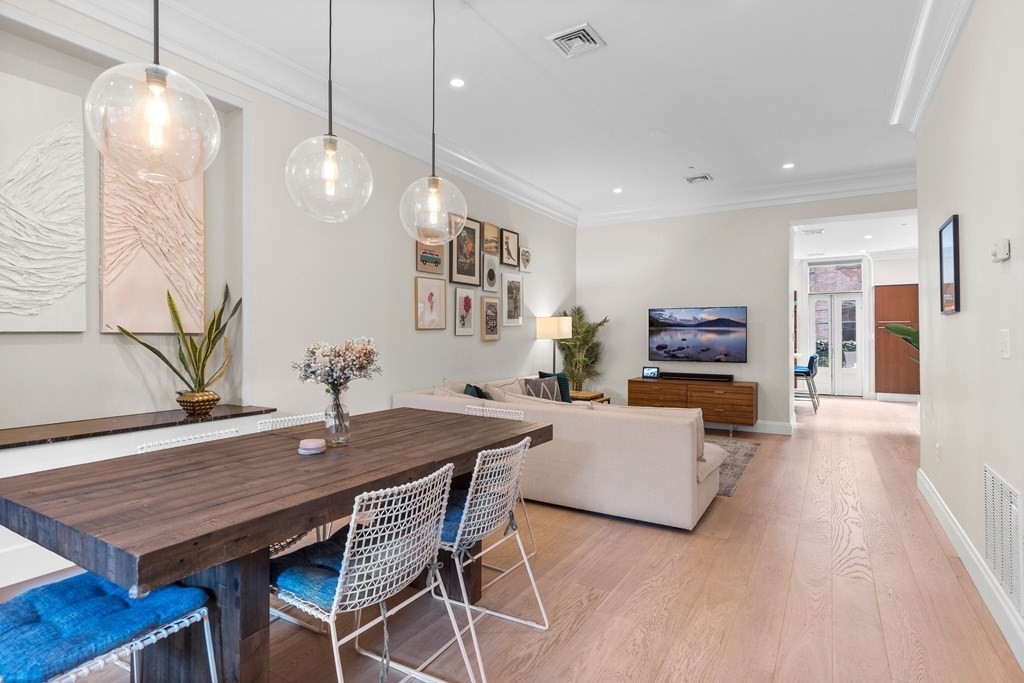 192 West Springfield Street, Unit 1 Boston, MA 02118 - Photo 2 of 26 a view of a dining room with furniture and wooden floor