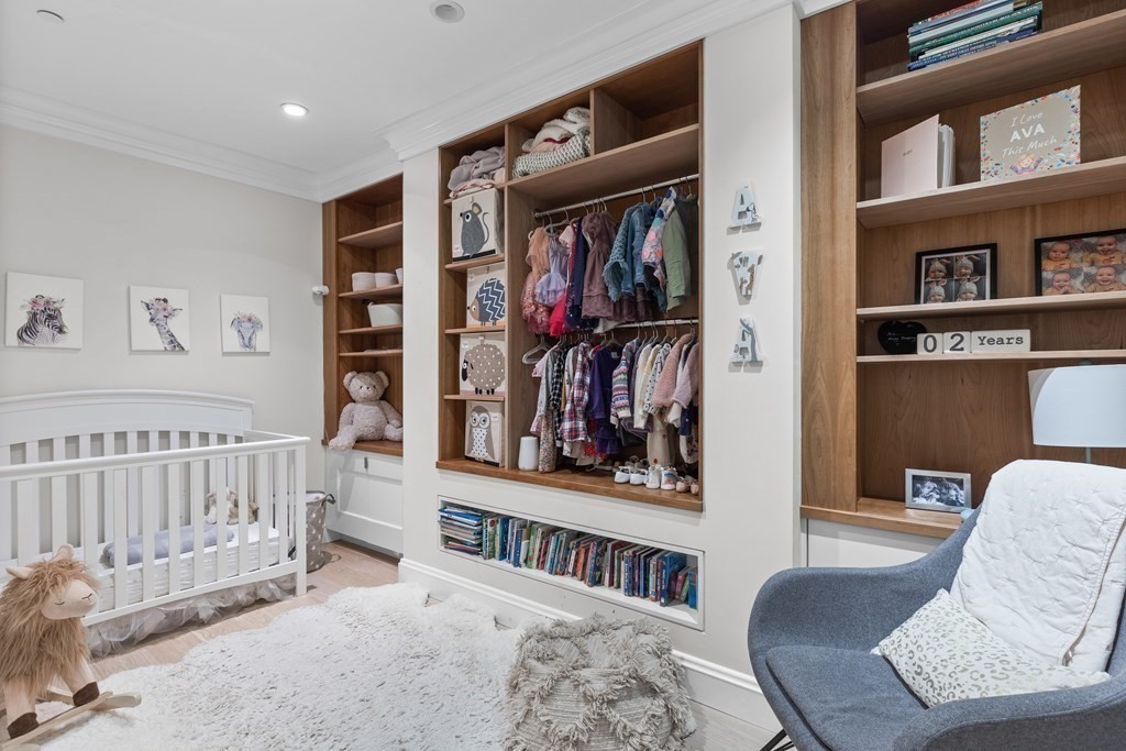 192 West Springfield Street, Unit 1 Boston, MA 02118 - Photo 21 of 26 a bedroom with furniture and a book shelf