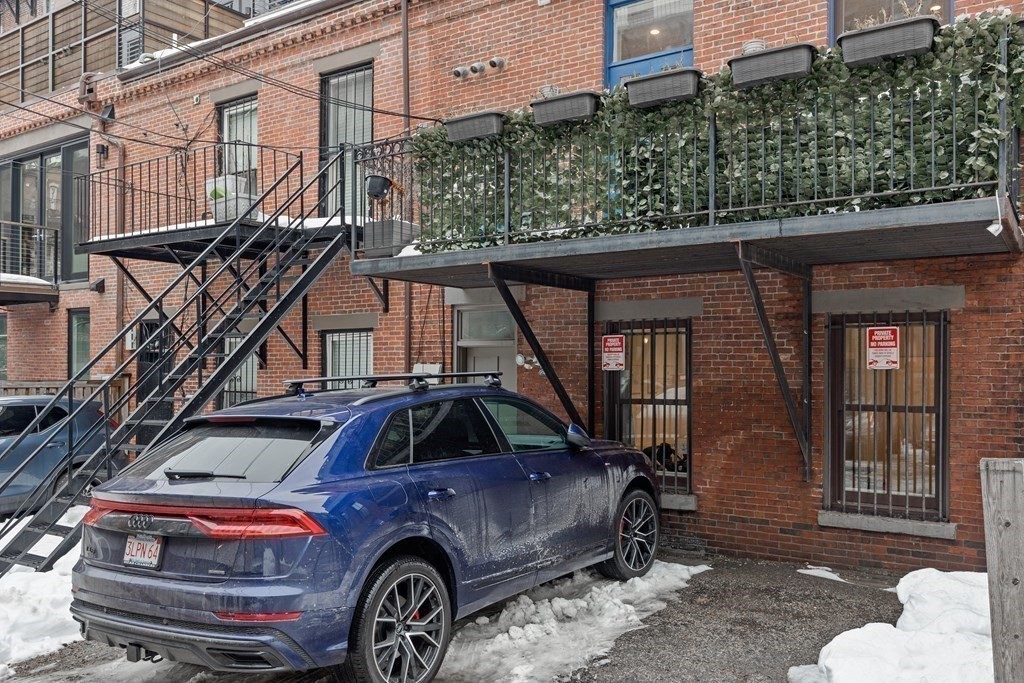 192 West Springfield Street, Unit 1 Boston, MA 02118 - Photo 23 of 26 a front view of a house with large trees