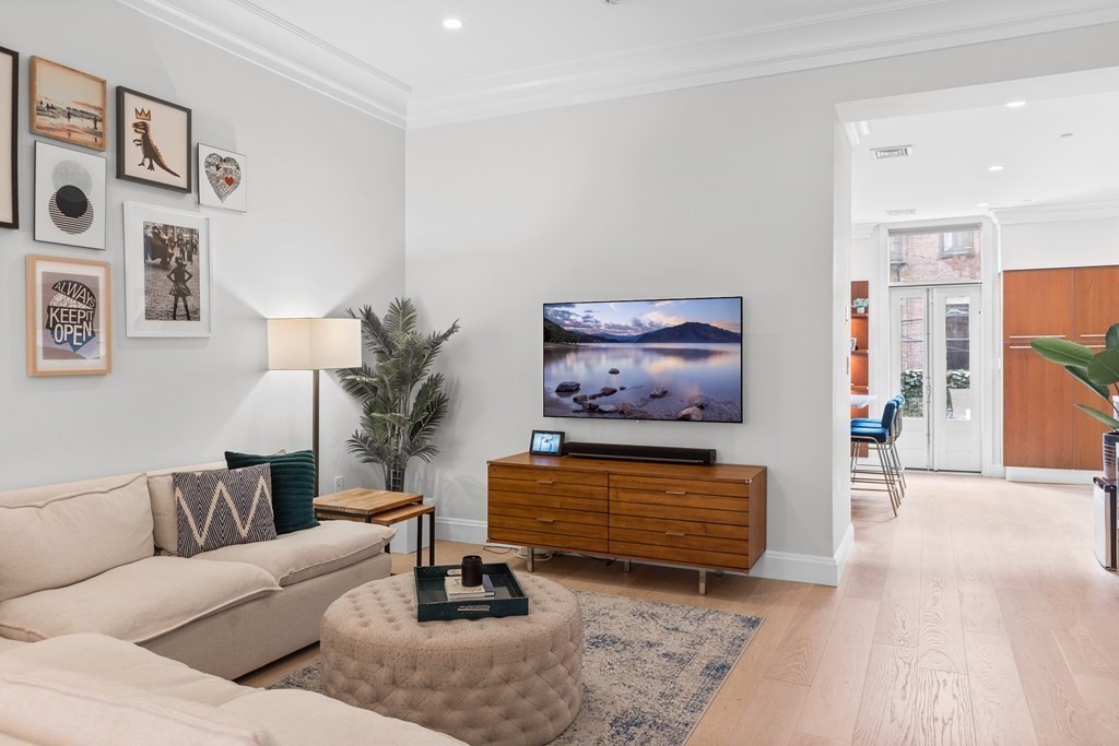192 West Springfield Street, Unit 1 Boston, MA 02118 - Photo 7 of 26 a living room with furniture and a flat screen tv