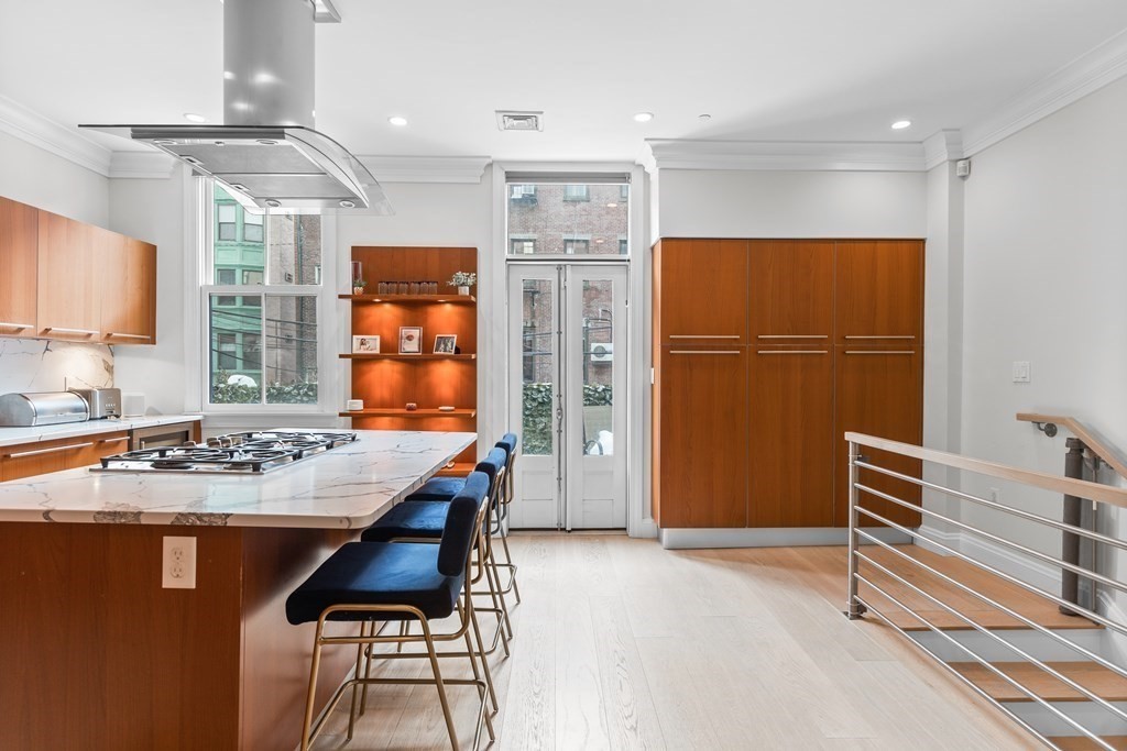 192 West Springfield Street, Unit 1 Boston, MA 02118 - Photo 8 of 26 a dining room with stainless steel appliances a refrigerator and a dresser
