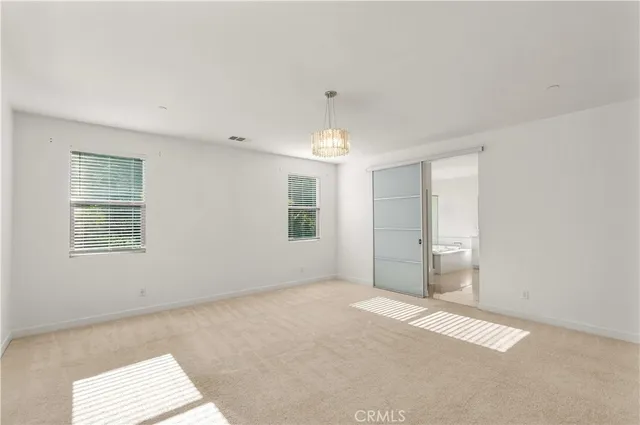 a bathroom with a granite countertop tub sink shower and mirror
