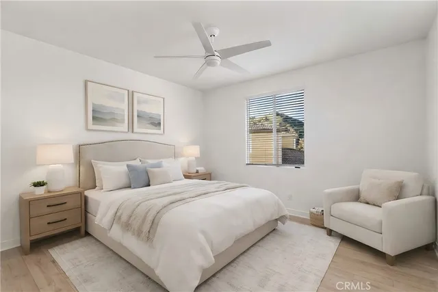 a bedroom with bed and a window