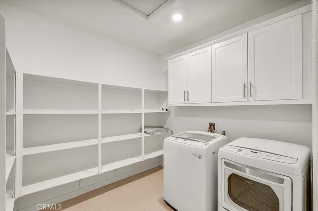 a bathroom with a double vanity sink mirror and a bathtub