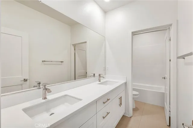 an empty room with a window and a ceiling fan