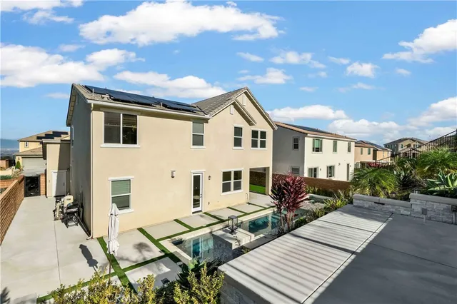 a view of a chairs and table in a balcony