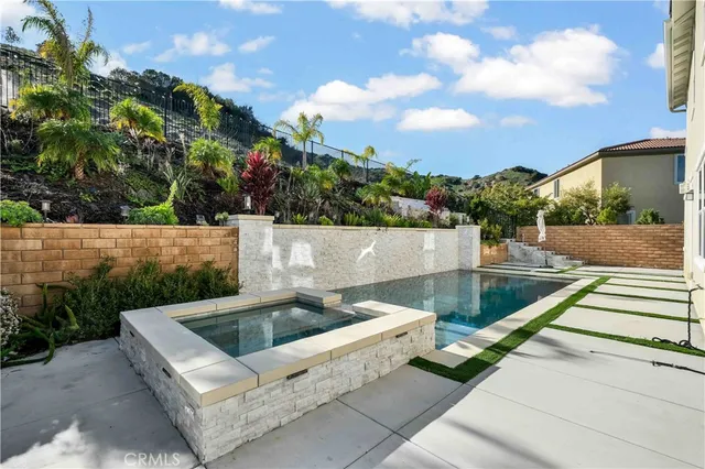 a view of house with a yard