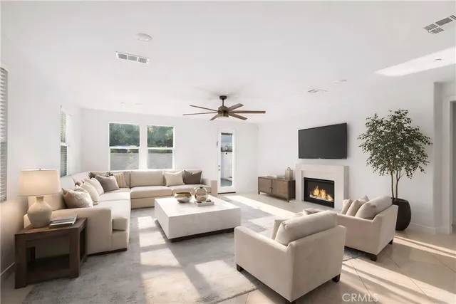 a living room with furniture fireplace and a flat screen tv