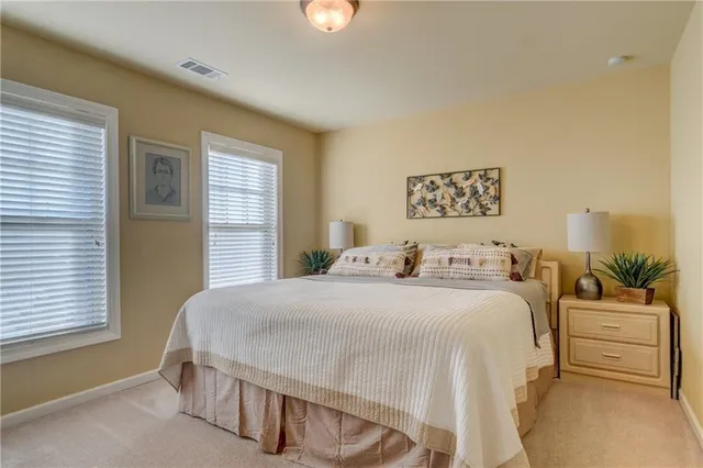 a bedroom with a bed and a couch