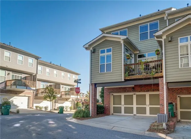 a front view of a house with a large window
