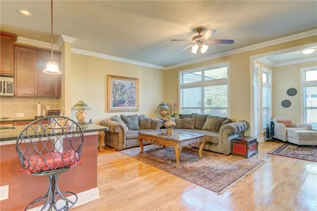 a living room with lots of furniture and a chandelier