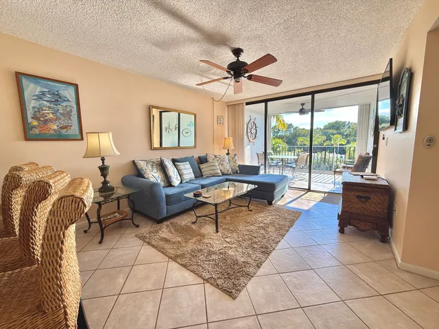 a view of a living room with furniture and a flat screen tv