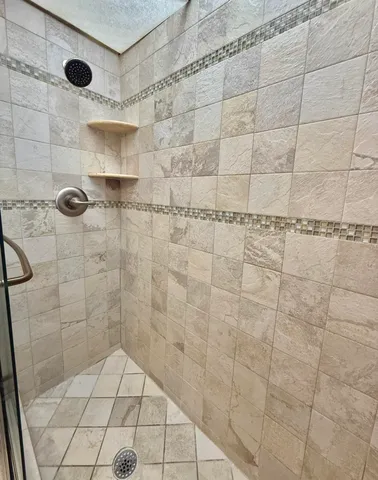 a view of swimming pool with outdoor seating and a patio