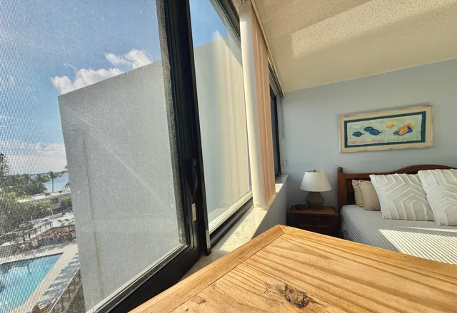 a view of a chairs and tables in patio