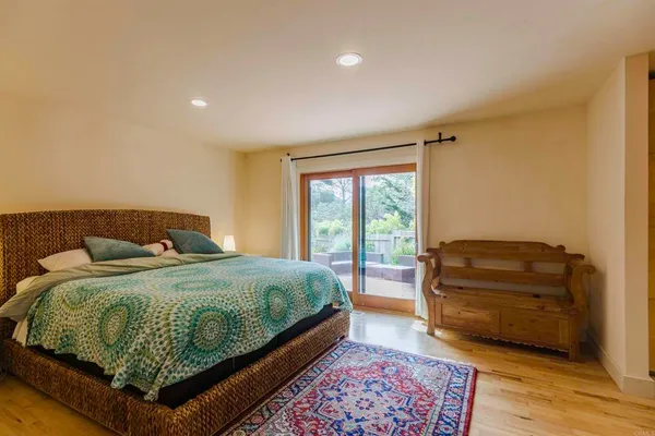 a bedroom with a bed and a couch
