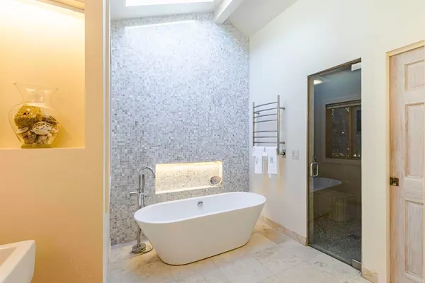 a bathroom with a bathtub and toilet