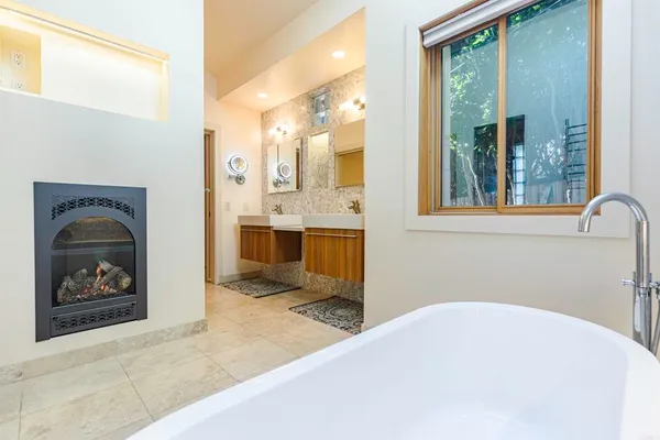 a bathroom with a tub and shower