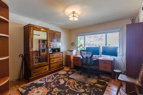 a view of a backyard with sitting area
