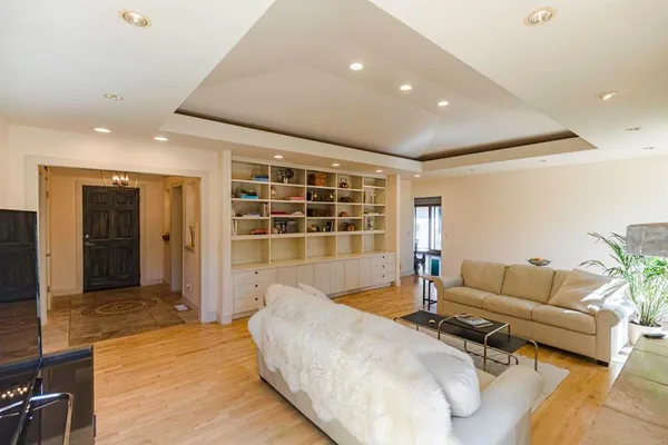 a living room with furniture and windows