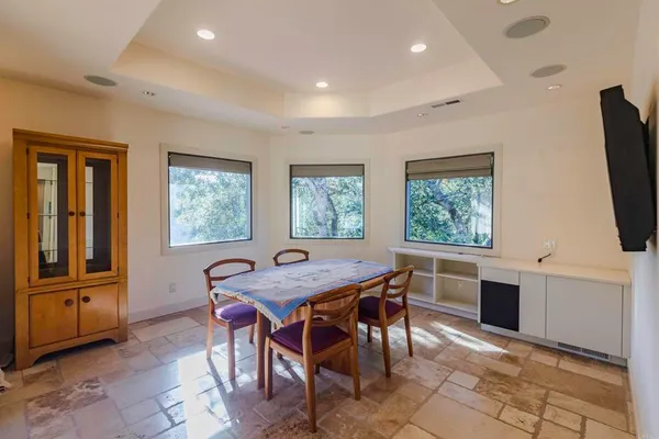 a dining room with furniture and window