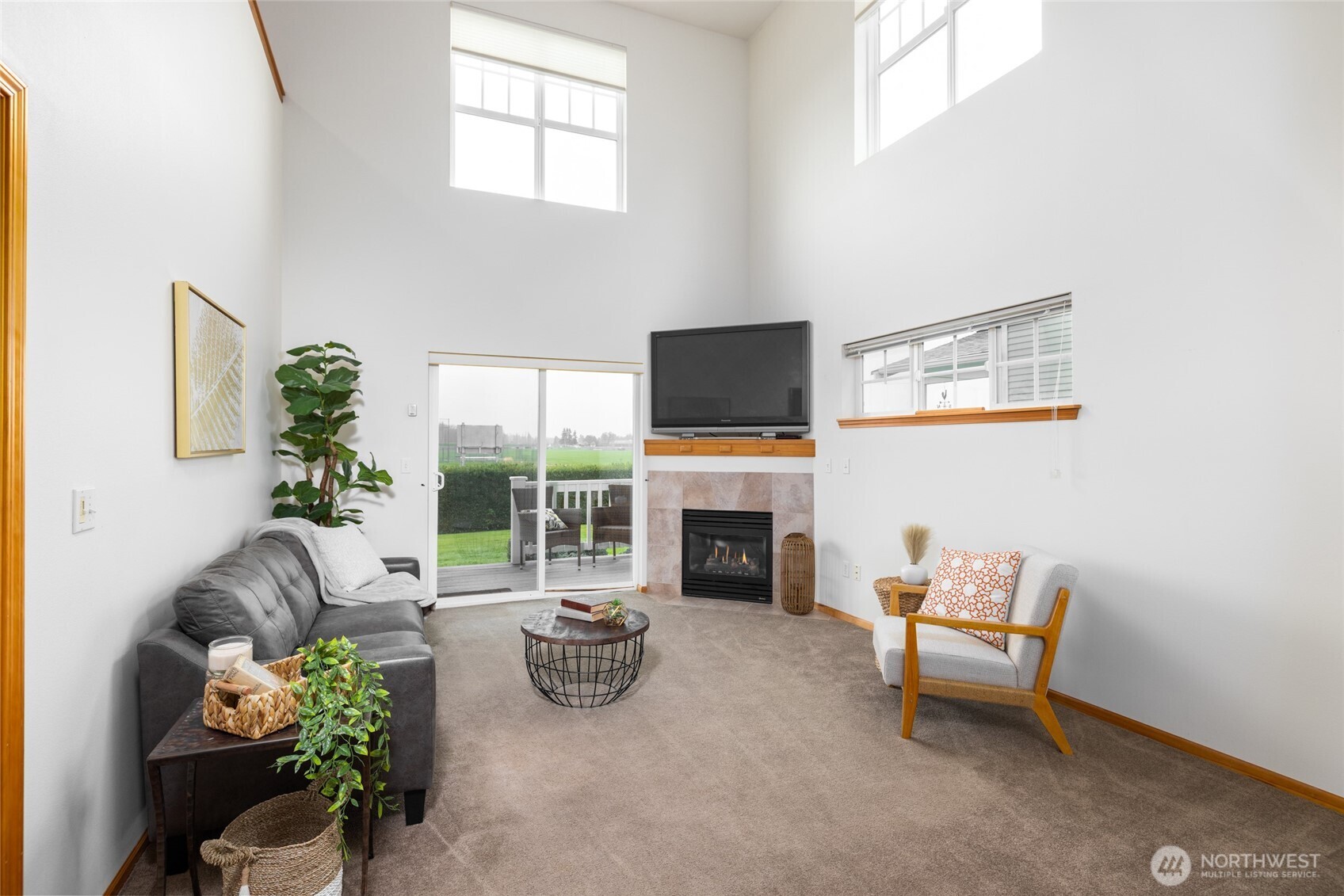 1182 Decatur Circle, Unit 7A Burlington, WA 98233 - Photo 14 of 36 a living room with furniture a fireplace and a flat screen tv