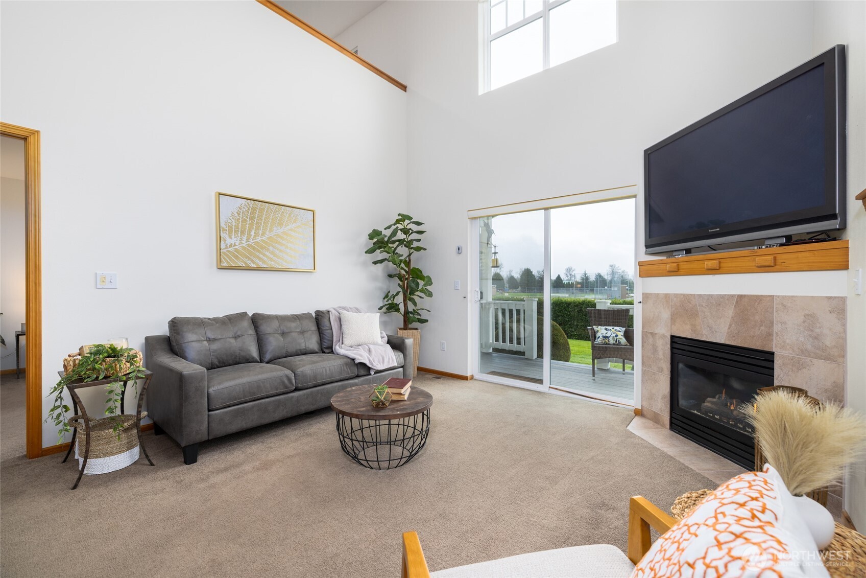 1182 Decatur Circle, Unit 7A Burlington, WA 98233 - Photo 16 of 36 a living room with furniture a flat screen tv and a fireplace